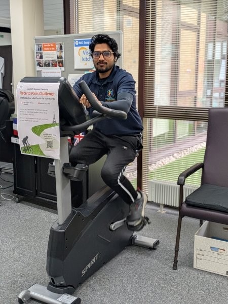 Physiotherapist Abbas using a stationary exercise bike