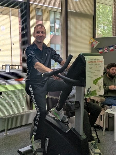 A man using a stationary exercise bike