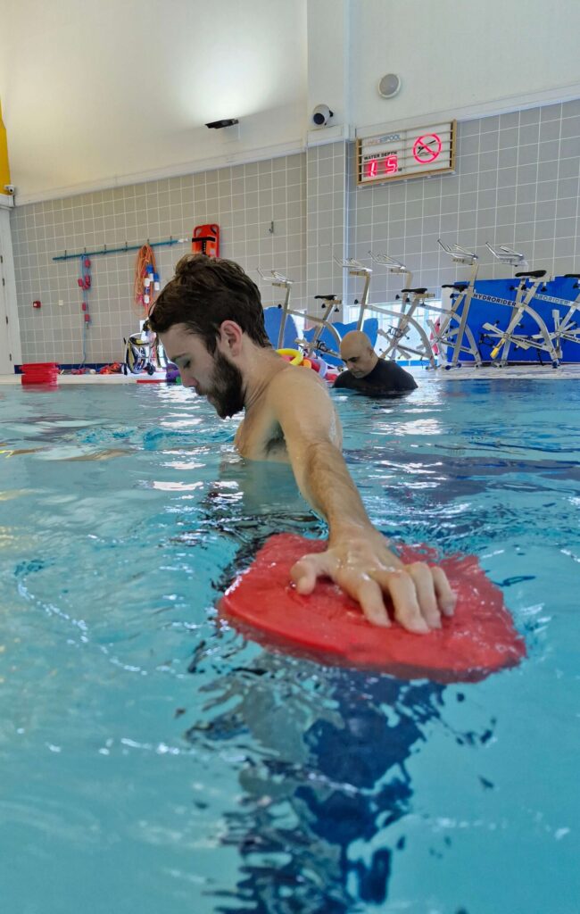 A man taking part in an aquatic exercise class