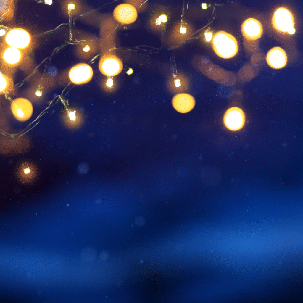 Golden Christmas lights on a dark blue background