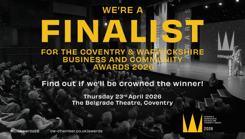 Text overlaid over a black and white image of an award ceremony. The text reads: We're a finalist in the Coventry & Warwickshire Business and Community Awards 2026
