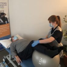 A physiotherapist treating a patient